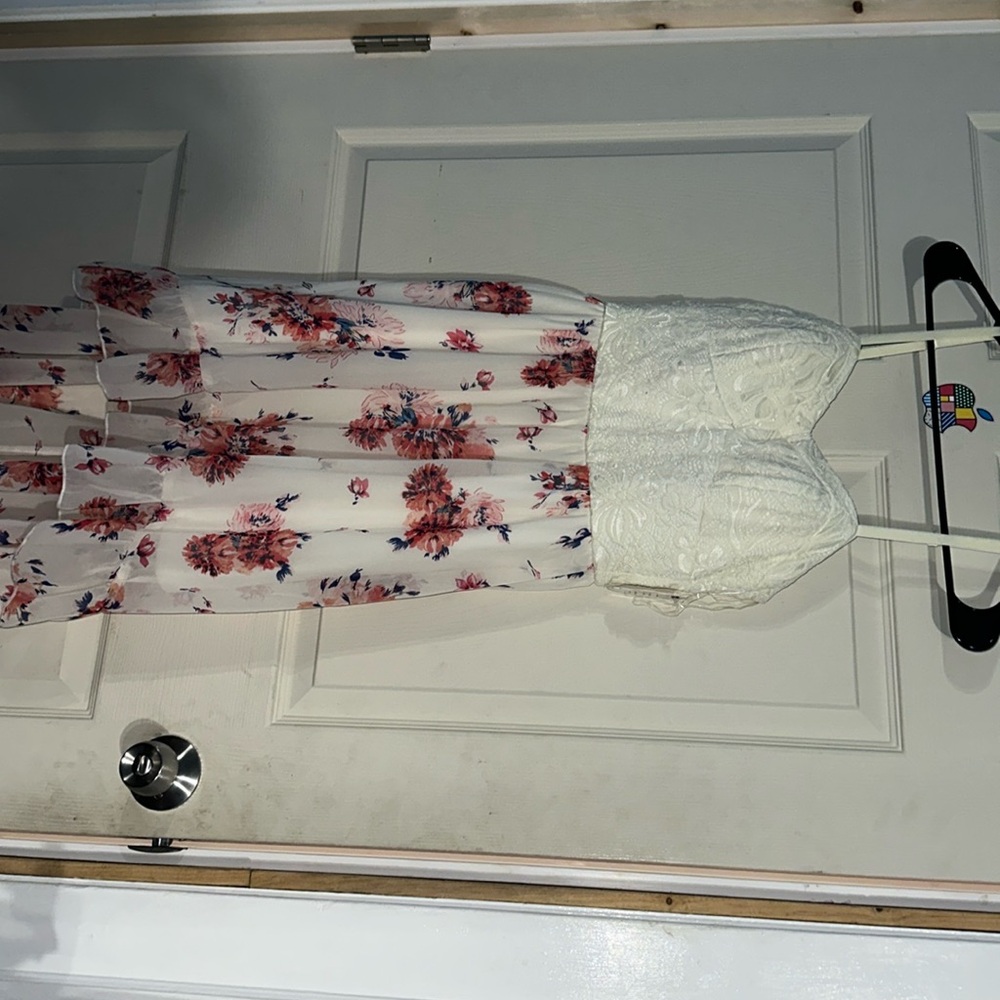 Beautiful white dress with flowers was a gift and never used.